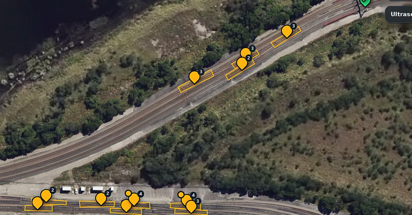 Aerial view of a rail loop with inspection markers on the turnouts